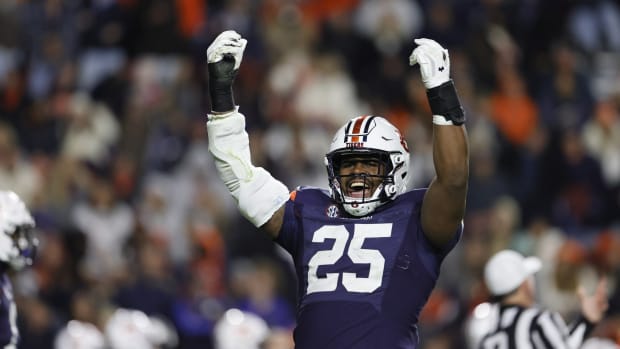 Nov 12, 2022; Auburn, Alabama, USA; Auburn Tigers defensive end Colby Wooden (25) tries to get the fans excited starting the fourth quarter against the Texas A&M Aggies at Jordan-Hare Stadium. Mandatory Credit: John Reed-USA TODAY Sports